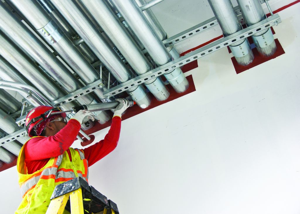 A-firestopping-sealant-applied-by-caulking-gun.